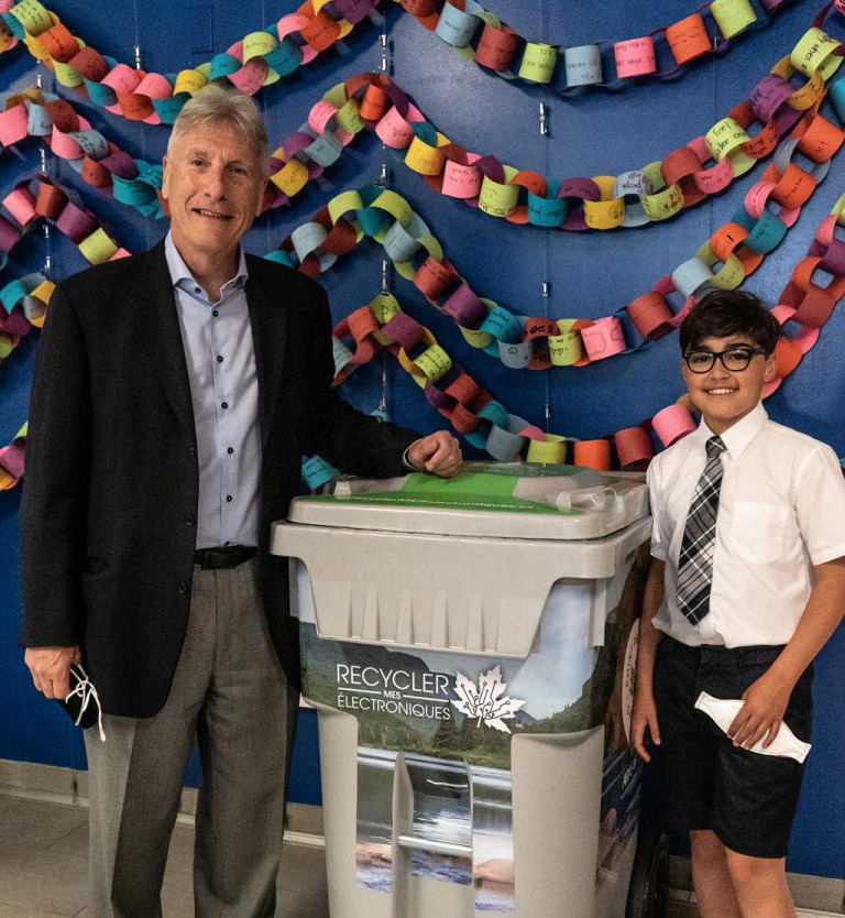 EPRA CEO Cliff Hacking standing with student
